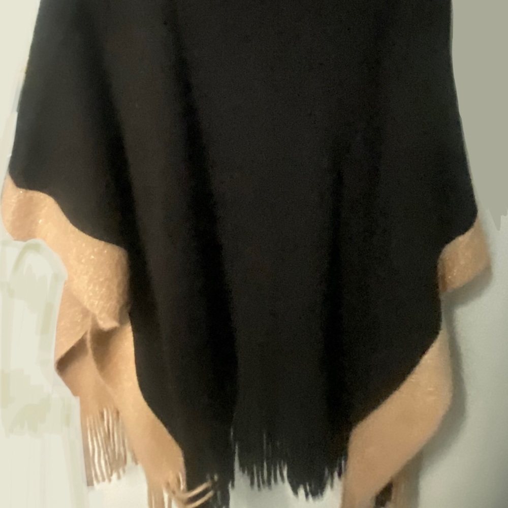 Turtleneck knit poncho with pockets